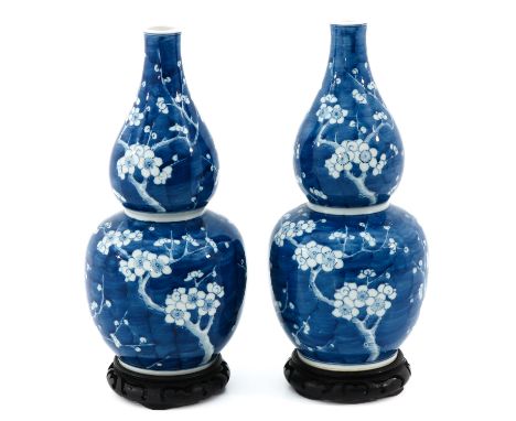 Blue ground with white flower blossom decor, marked with double ring on bottom, 39 cm. tall including base.