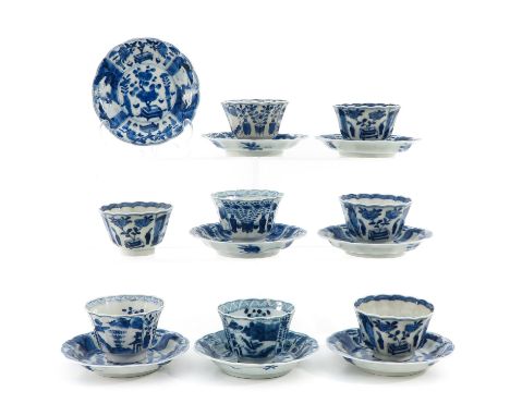 8 cups and 8 saucers, blue and white decor depicting scene in garden, saucers are. 13 cm. in diameter.