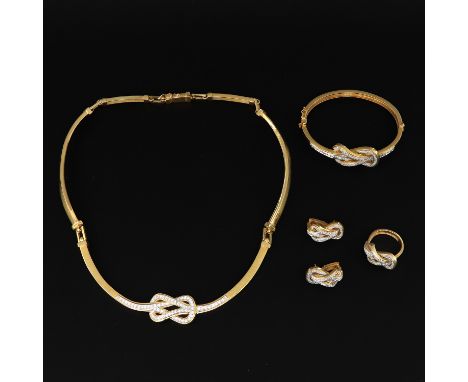 Including necklace, bracelet, ring and earrings, all set with diamonds for an approximate total weight of 3.66 carats. Diamon