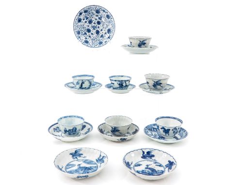 Including 7 cups and 10 saucers, in a variety of blue and white decors, largest saucer is 12 cm. in diameter, chip and hairli