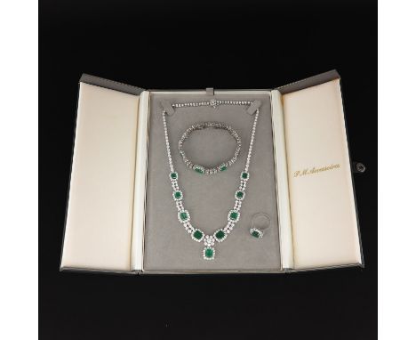 Including ring, bracelet, and necklace, all set in 18KG with brilliant cut diamonds and faceted emeralds, largest 9 x 7 mm., 