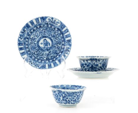 Depicting Chinese figures in center with floral decor surrounding, marked with sacred fungus, saucers are 12 cm. in diameter,