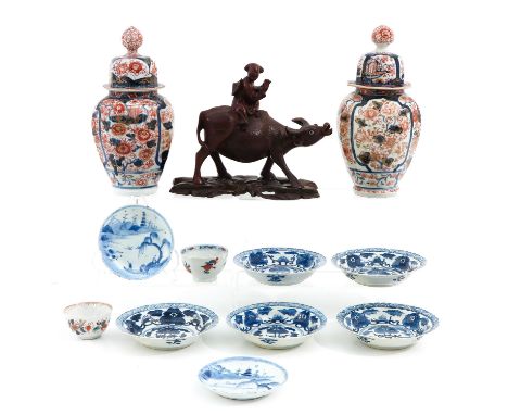  12 items including small plates, saucers, cups, sculpture and pair of Imari vases with covers 24 cm. tall. 