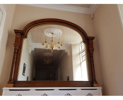 A large over mantel wall mirror having turned supports and gilt detailing , width approx. 187cm