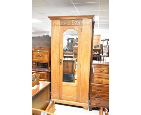 A late Victorian oak single mirror door wardrobe having one fitted shelf and octapus hooks, width approx. 95cm.&nbsp;