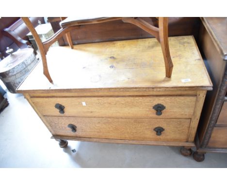 A two drawer chest, possibly previously wardrobe base, mix of woods, mainly golden oak, dimensions approx. W92 H60 D44cm