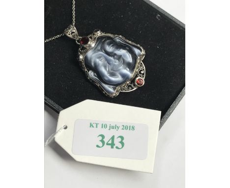 Rock crystal figure of a Buddha inset with ruby cabochons