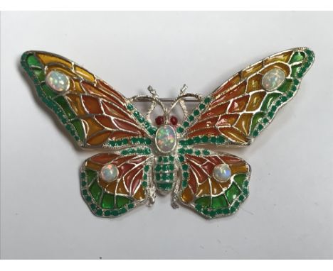 Silver and plique a jour butterfly brooch inset with opal and ruby eyes