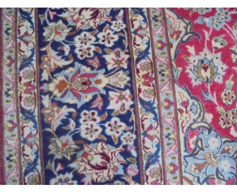 Good large Persian design carpet, bright red ground with stylized floral decoration