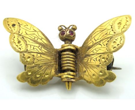 An antique 18ct gold moth brooch set with possibly ruby eyes, 31mm wide, 5.5g