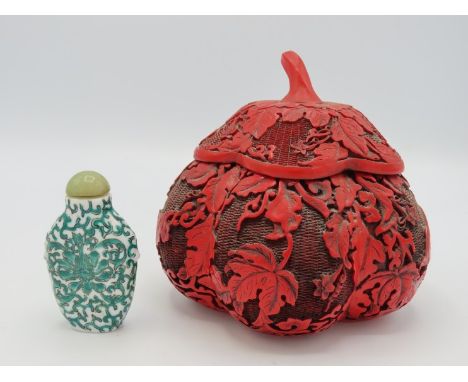 A mid 20thC. Chinese lacquer style gourd shaped lidded pot & cover, 123mm high x 120mm wide twinned with a Chinese porcelain 