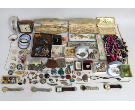 A quantity of costume jewellery items including wristwatches, a micro mosaic brooch, wedgwood pendant, a silver memorial broo