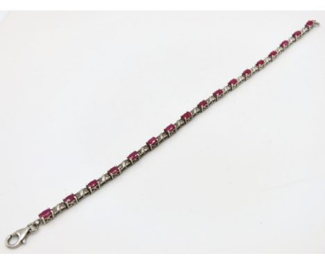 A silver tennis bracelet set with ruby & diamond, ruby 4.75mm wide, bracelet 195mm long, 9.4g