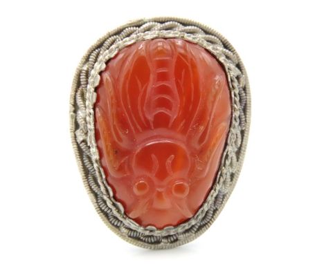 An antique Chinese silver mounted clip brooch set with carved carnelian stone depicting a bee, 34mm x 27mm, 12.1g