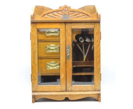 An oak Edwardian pip smokers cabinet with three drawers & internal pipe rack, bears plaque 1910 Tenbury, 467mm tall x 327mm w