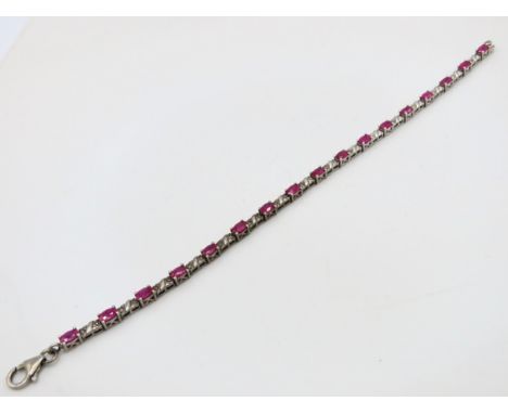 A silver tennis bracelet set with ruby & diamond, ruby 4.75mm wide, bracelet 190mm long, 9.2g