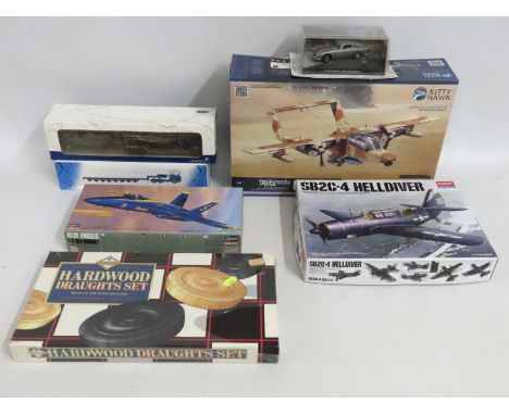 A boxed Kitty Hawk 1:32 scale model kit, an Academy 1:72 scale model kit & one Hasagawa 1:72 model kit twinned with a Solido 