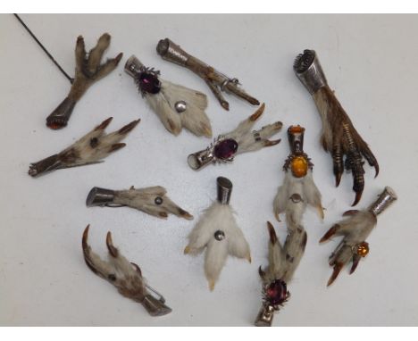 A collection of Scottish silver &amp; grouse claw kilt pins.