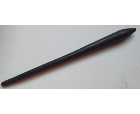 An Aboriginal throwing stick of overall grooved design, 24.5".