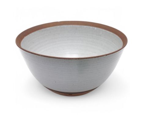 David Lloyd Jones (1928-1994); large studio pottery stoneware bowl, in speckled grey glaze with irregular iron rim, impressed