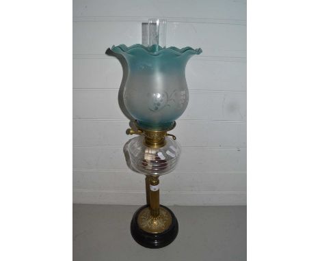 Brass based oil lamp with frosted glass shade