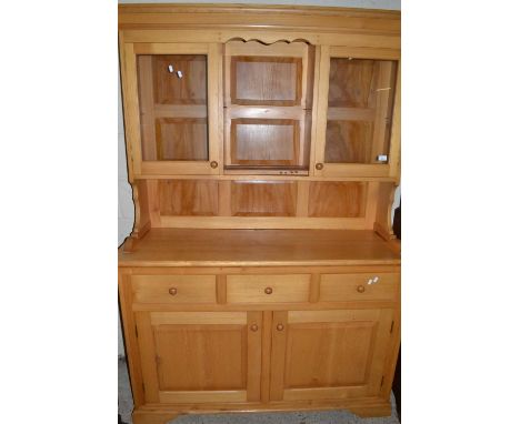Modern light wood kitchen dresser with glazed top section over a base with three drawers and three doors, 136cm wide
