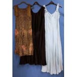 A quantity of c.1920/30's lady's clothing, to include a black velvet cloak by Dickins & Jones, a