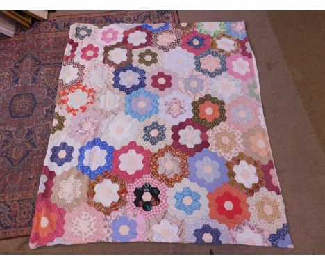 A mid 20th century patchwork quilt cover, with later plain cotton backing and press stud fastening, 192 x 171cm