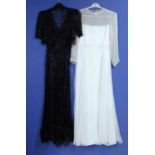 A lady's black net and sequin ribbon V neck dress with matching bolero, together with a cream