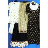 A quantity of circa 1970's lady's wear: to include a brown floral short sleeve full length dress