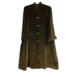 A lady's black velvet Aquascutum coat, single breasted with side slip pockets