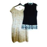 Two c.1960's dresses, to include a black and silver sleeveless shift minidress by Hershelle and a