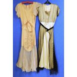 Two c.1930's lady's dresses, to include an apricot satin and net dress with V neck, net sleeves