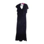 A black velvet evening gown, the sleeveless bias cut V-neck gown with matching shrug and long velvet
