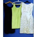 Three mid 20th Century lady's cocktail dresses: to include a black floral broderie anglaise style