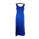 A mid 20th century evening gown, the custom made blue satin sleeveless shift with deep V-back and