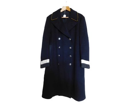 An Eastern Counties Omnibus driver/conductors overcoat, double breasted in navy blue wool, yellow piping to collar and reflec