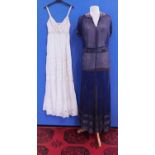 A navy blue chiffon heavily beaded dress with matching tie belt, with V-neck and collar with bugle