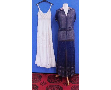 A navy blue chiffon heavily beaded dress with matching tie belt, with V-neck and collar with bugle bead detail, matching desi