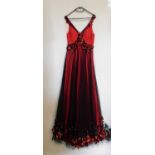 A red and black gown, the red silk with black net overlay, sleeveless with ruched bust and sequinned