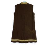 A ladies mid 20th Century sleeveless shift mini dress with black and gold detailing to neck and hem,