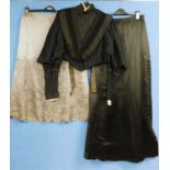 A lady's late Victorian black jacket with high neck and lace trim, deep V neck front with black