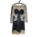 A black and cream beaded cocktail dress, the cream net mesh with strategic sequin detail and