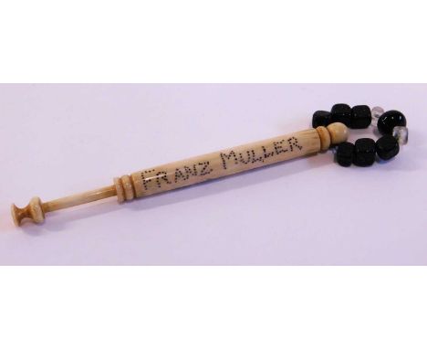 A 'hanging bobbin', carved in bone with pierced decortion 'FRANZ MULLER HUNG 1864' with black and clear glass beaded spangleF
