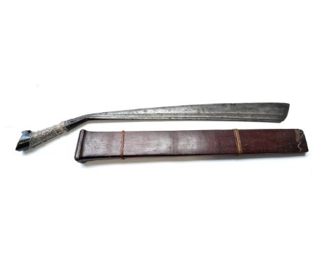 A 19th Century Parang Latok, Kalimantan, the 48cm heavy steel blade angled at the hilt and widening at the tip, the straight 