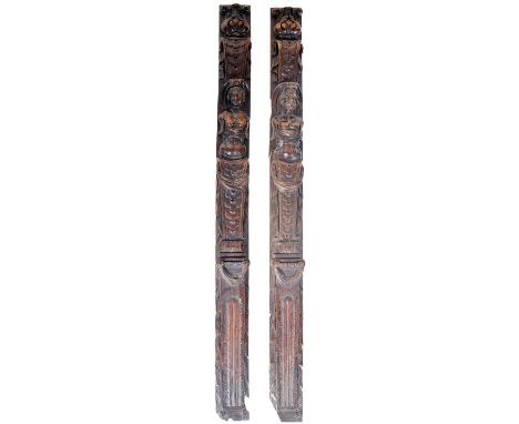 A pair of 17th Century heavily carved walnut architectural panels of Caryatids and Telamon each with their torsos showing wit