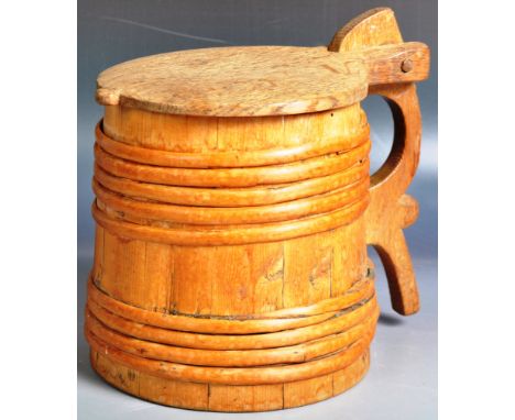 An early 19th Century Swedish Scandinavian folk art provincial wooden jug / pot of barrel shape having a carved circular lid 