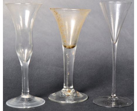 A collection of three George III drinking glasses dating from the 18th Century comprising a waisted bell shaped bowl example 