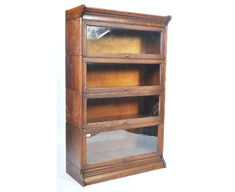 Globe Wernicke - An early 20th Century oak stacking lawyers / barristers library bookcase display cabinet having four glazed 