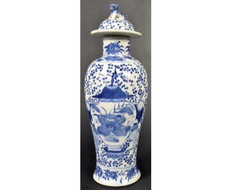 A 19th Century Chinese Qing dynasty Kangxi mark blue and white porcelain vase. The vase of baluster form with Foo dog decorat